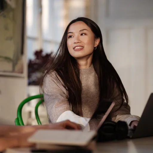 A young woman student studying with laptop at home