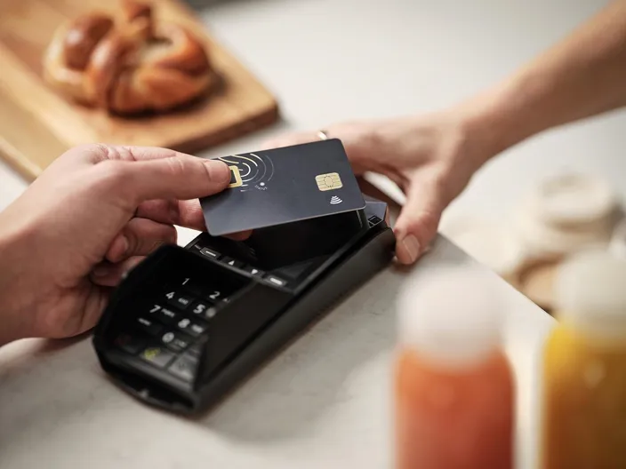 Contactless bank card payment using a fingerprint sensor closeup