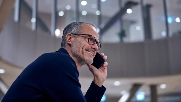 Man talking on the phone smiling portrait