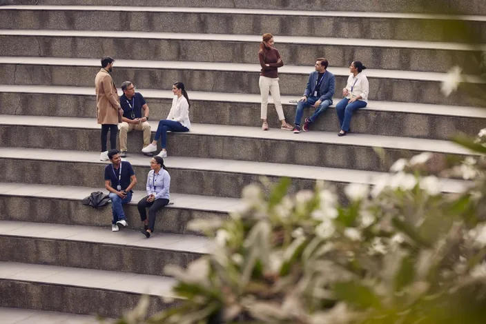 People meeting and talking outside on the stairs