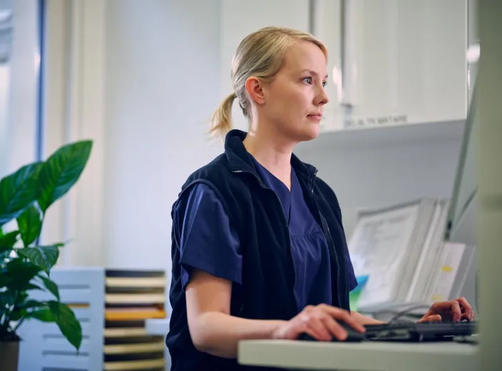 Lab medical specialist working on computer