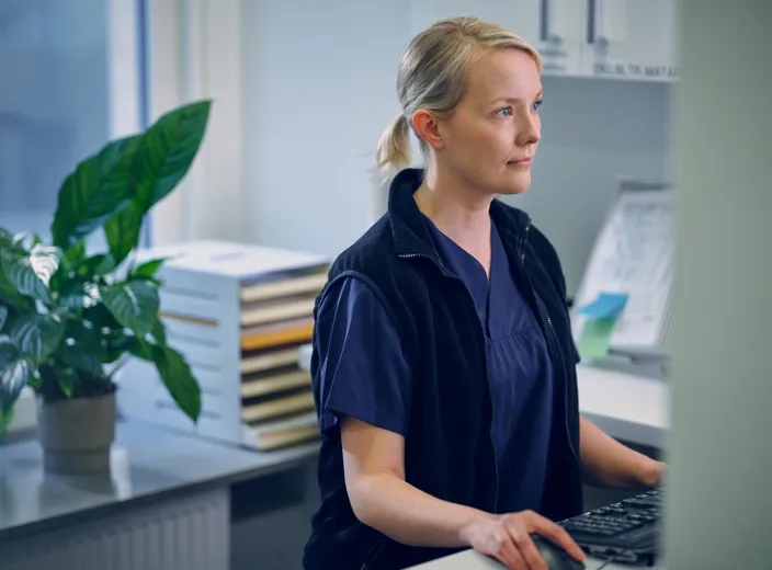 Lab medical specialist working on computer