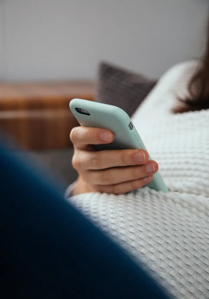 Pregnent woman close-up holding mobile phone