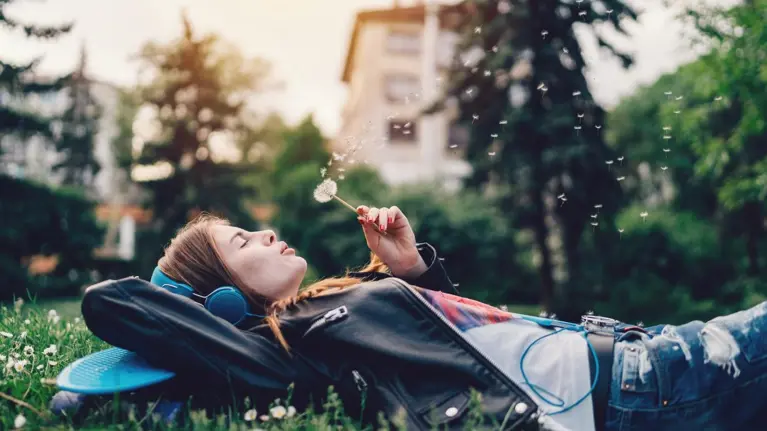 Relaxed teenage girl in the city park