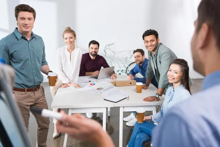 professional businesspeople discussing and brainstorming together at workplace in office