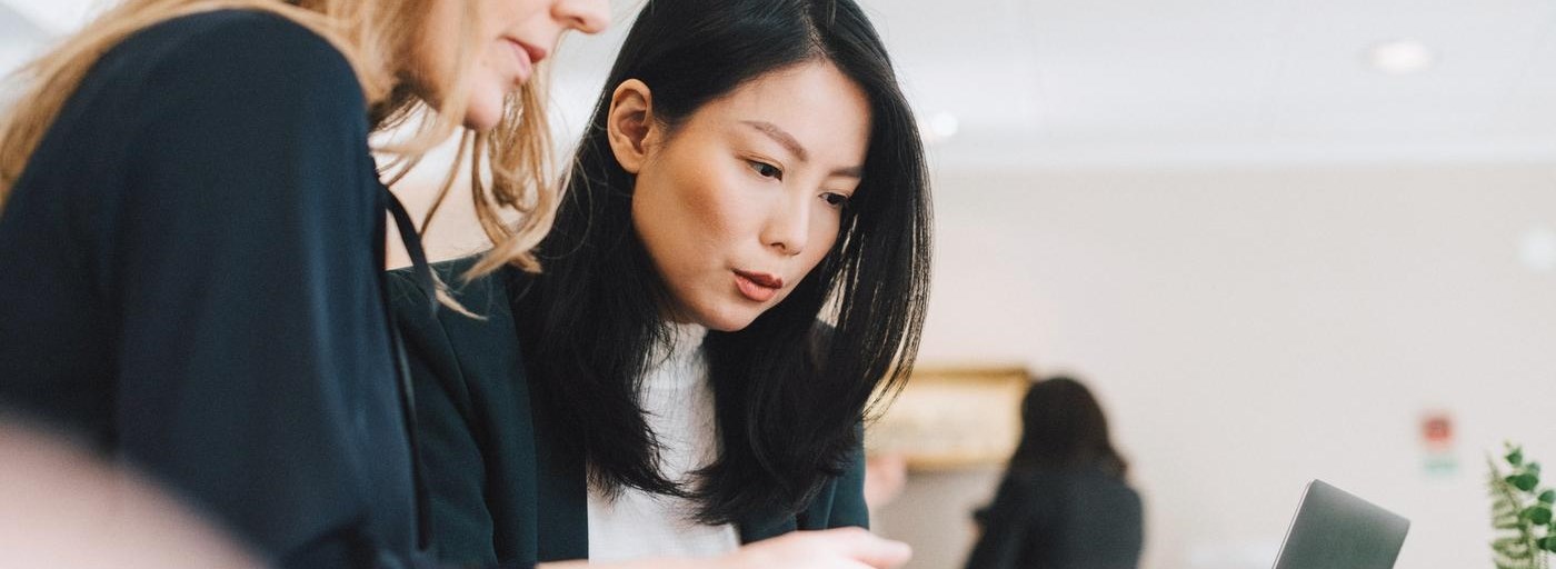 Colleagues use mobile phones during conferences in offices