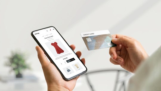 Shopping online with smart phone and credit card concept. Modern e-commerce web page with with women's clothing; Shutterstock ID 2185071909; purchase_order: N/A; job: TE-B; client: Tietoevry; other: 