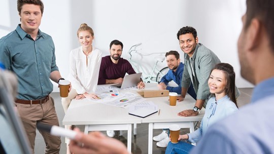 professional businesspeople discussing and brainstorming together at workplace in office