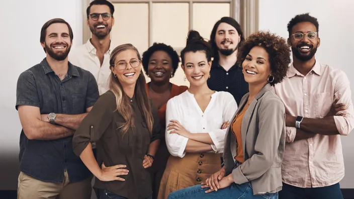 Group of coworkers at the office posing for a camera