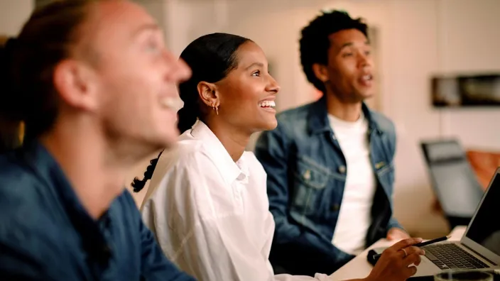 coworkers smiling durring a meeting