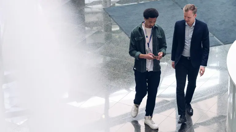 Employee meets visitor in the office lobby