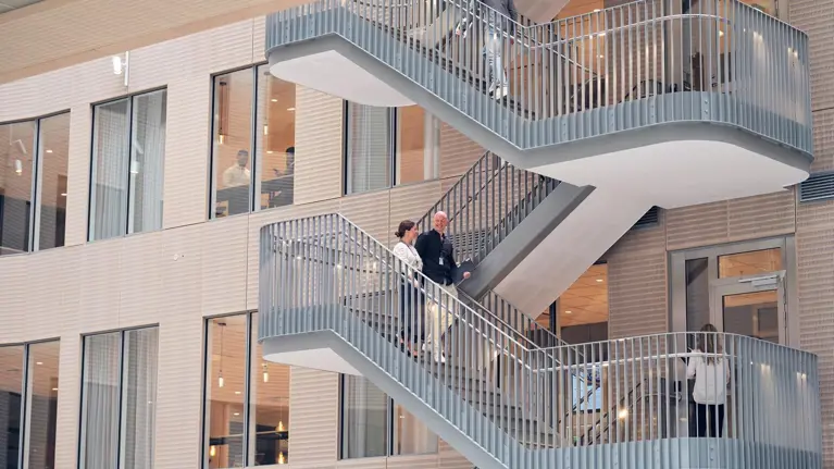 People walking the stairs in Tietoevry office