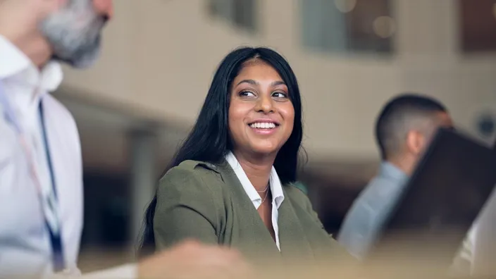 Woman in a meeting smiling