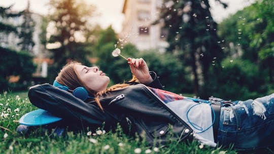 Relaxed teenage girl in the city park