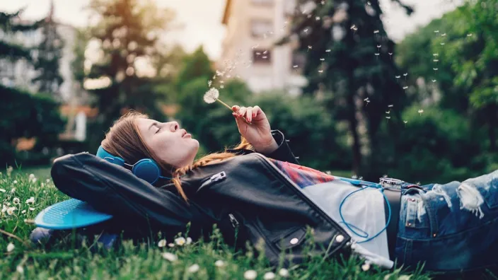 Relaxed teenage girl in the city park